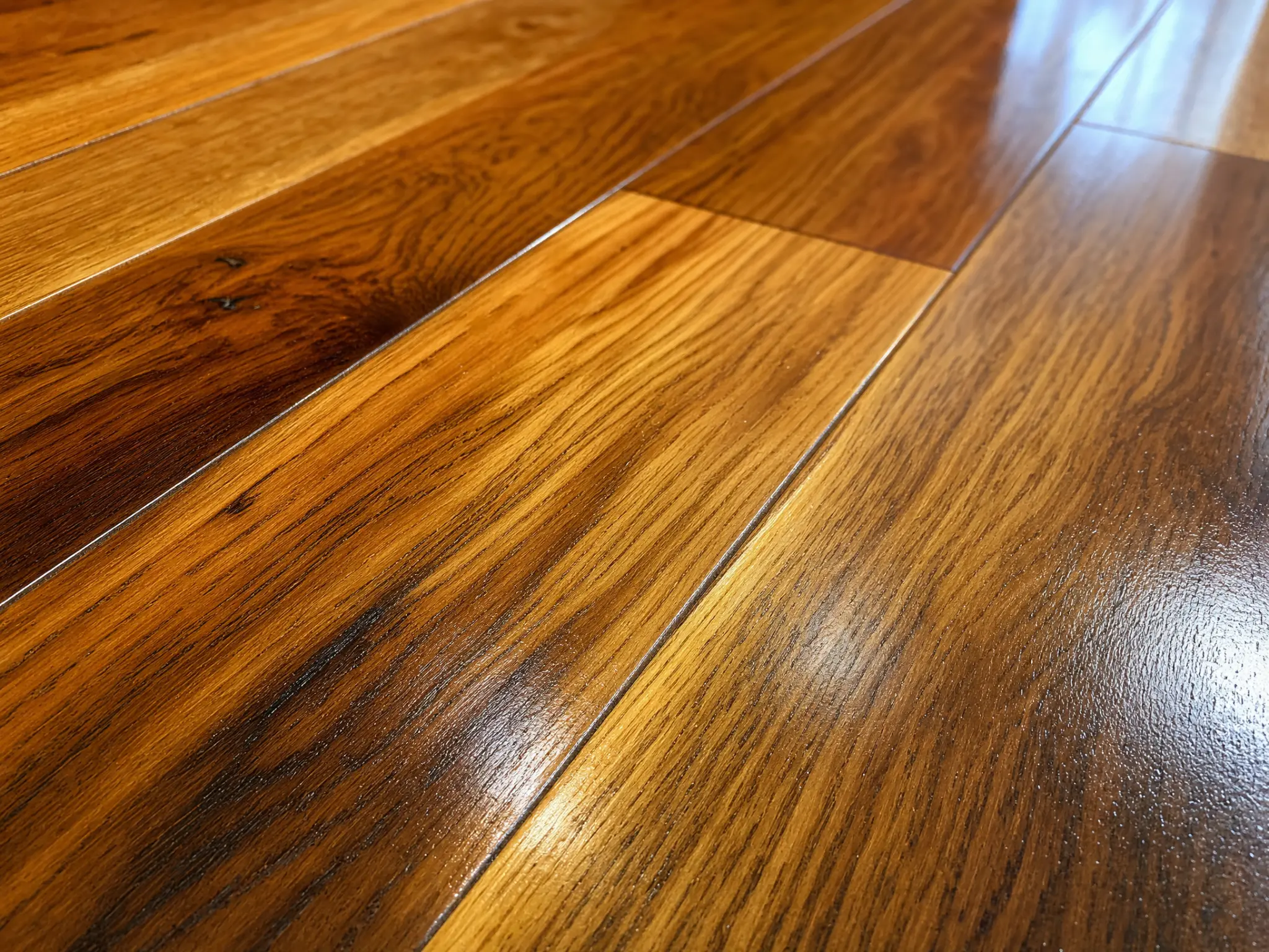 PHR-supplied close view of hardwood floor boards and grain.